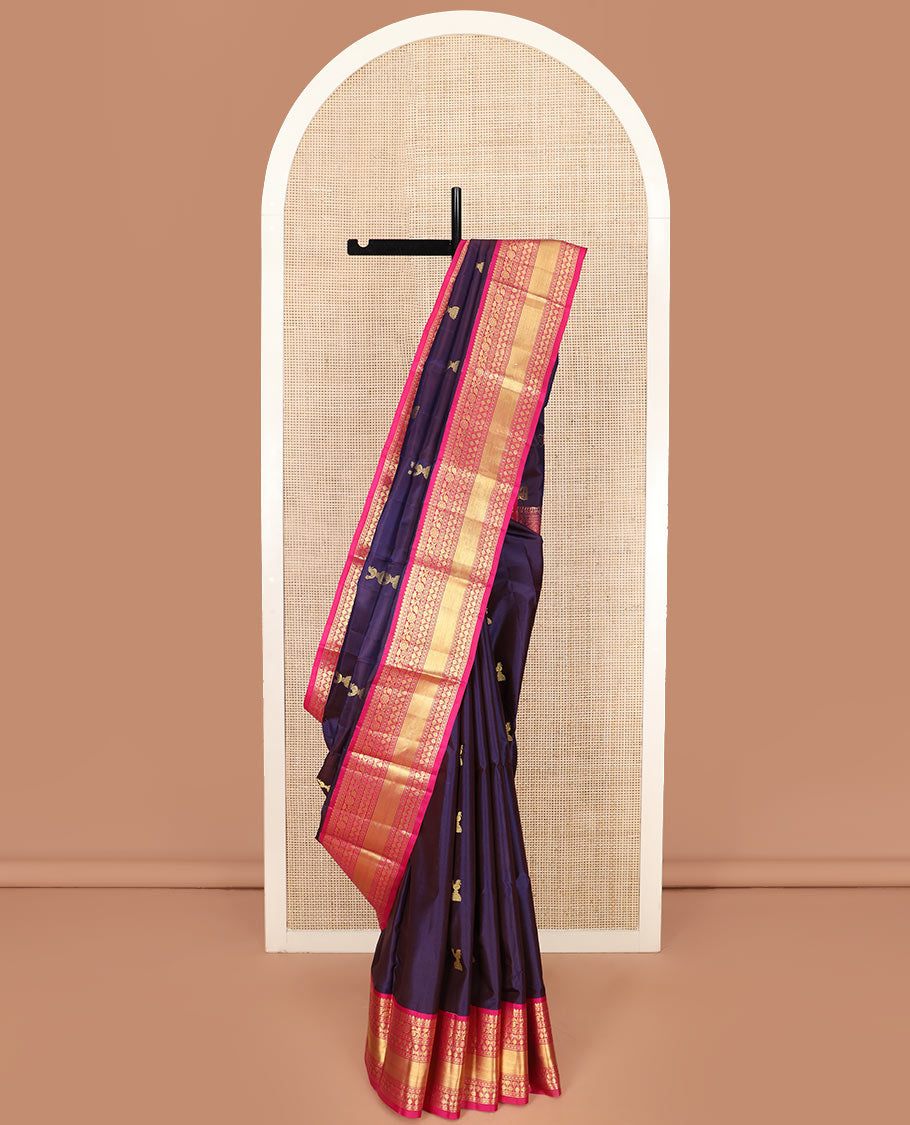 Navy Blue Vasundhara Silk Saree Adorned with Zari Buttas, Complemented by a Contrast Border of Thilakam, Diamond, Kodi Visiry, and Rudraksham Designs, Delicately Woven Pallu of Ara Maadam Designs, and a Contrast Blouse
