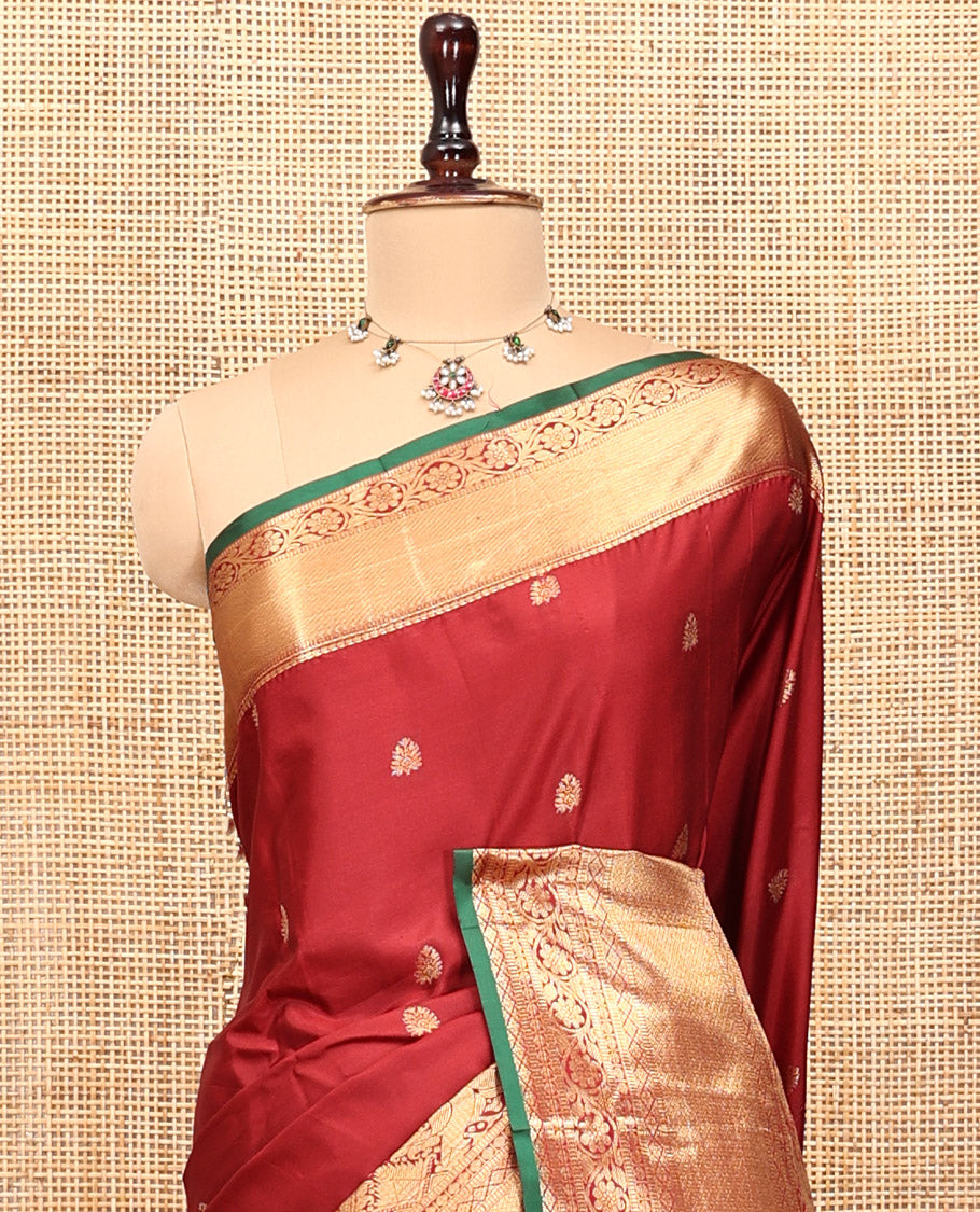 Maroon Budget Silk Saree, Dazzled with Zari Buttas, Highlighted by a Traditional Zari Border, Grand Ogee Pallu, and a Matching Blouse