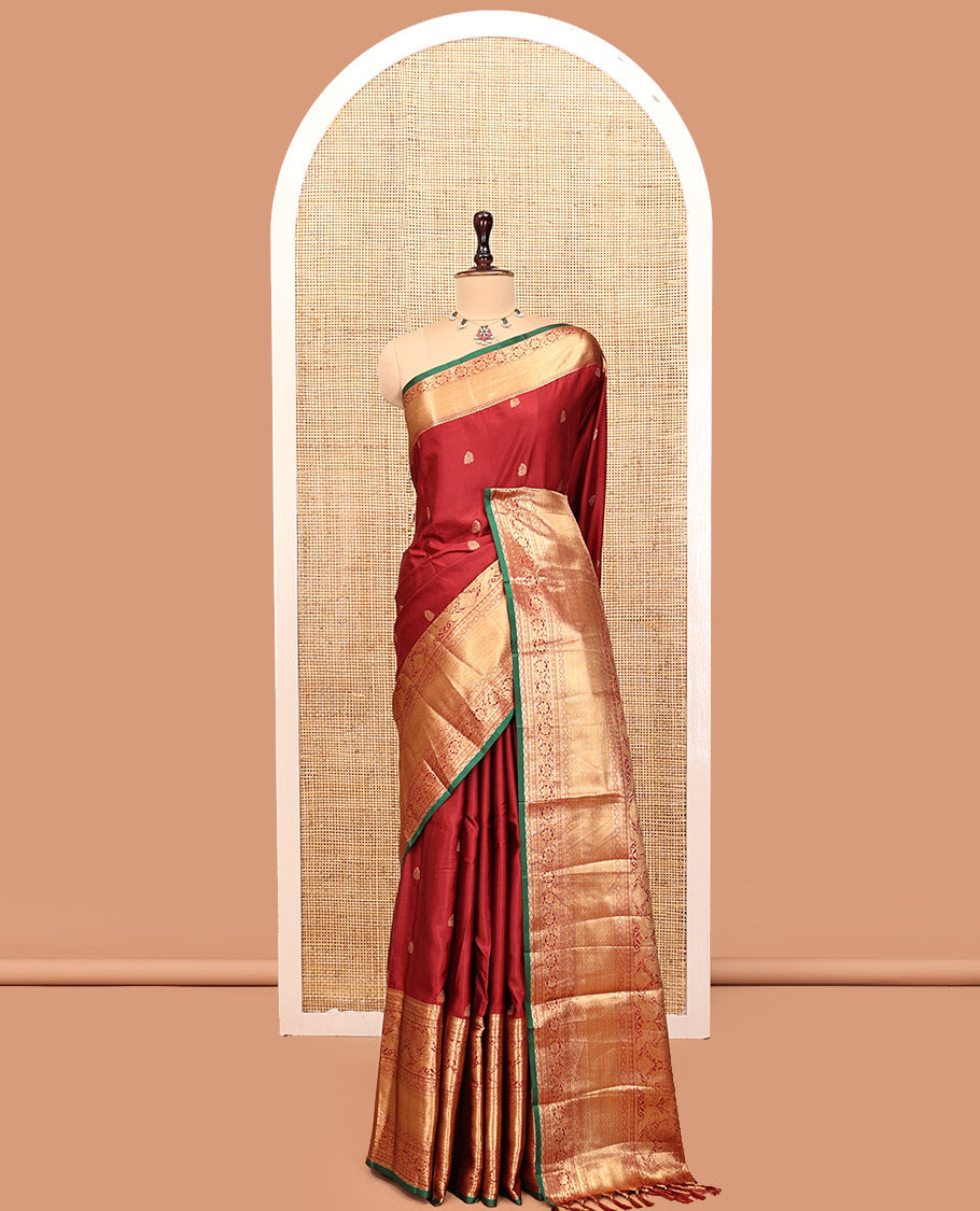 Maroon Budget Silk Saree, Dazzled with Zari Buttas, Highlighted by a Traditional Zari Border, Grand Ogee Pallu, and a Matching Blouse