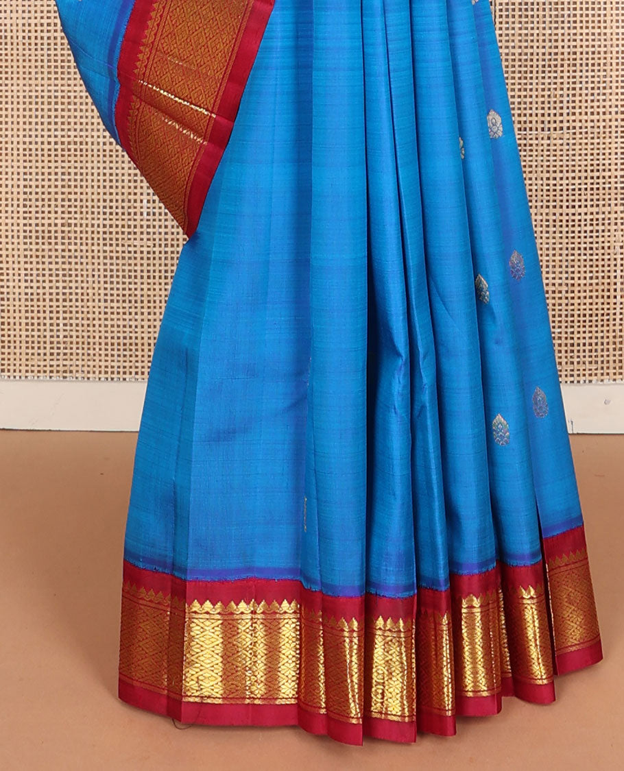 Blue zari buttas Kanchipuram silksaree, contrast one-sided korvai border of thilakam mokku & jaal design & zari design pallu