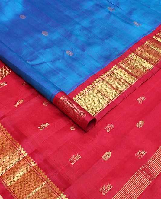 Blue zari buttas Kanchipuram silksaree, contrast one-sided korvai border of thilakam mokku & jaal design & zari design pallu