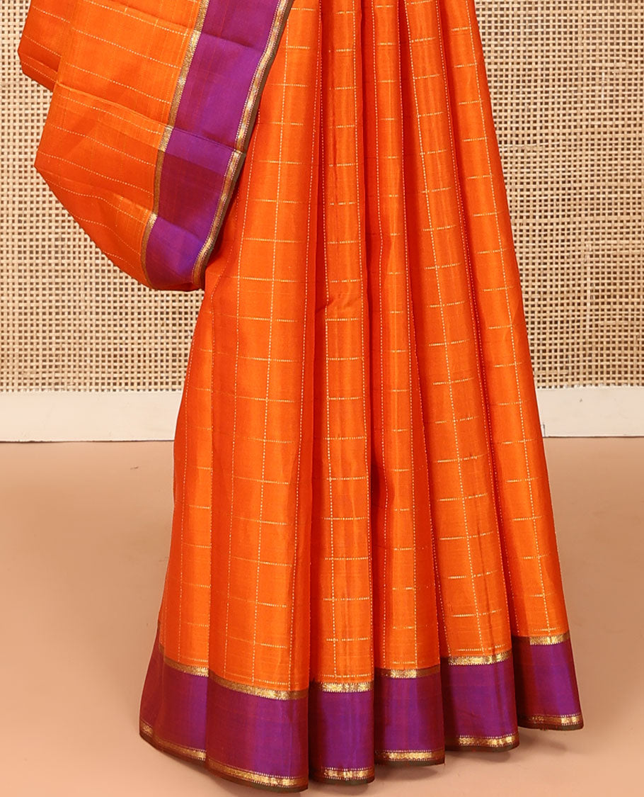 Orange zari checked Kanchipuram silk saree, contrast zari striped border, and pallu of manga kodi, laddu kamalam, and mayil designs