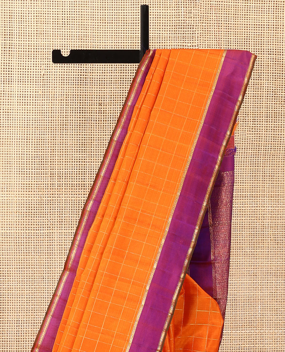 Orange zari checked Kanchipuram silk saree, contrast zari striped border, and pallu of manga kodi, laddu kamalam, and mayil designs