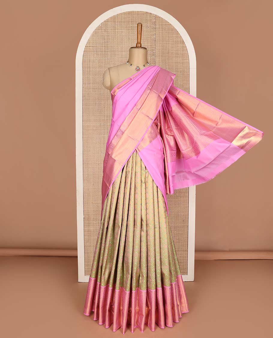 Green pure-silk half saree, jaal jacquard with contrast traditional zari bordered skirt, blouse of rekku, paisa, banaras, rekku, diamond, and then kuli kann, and intricate dhavani