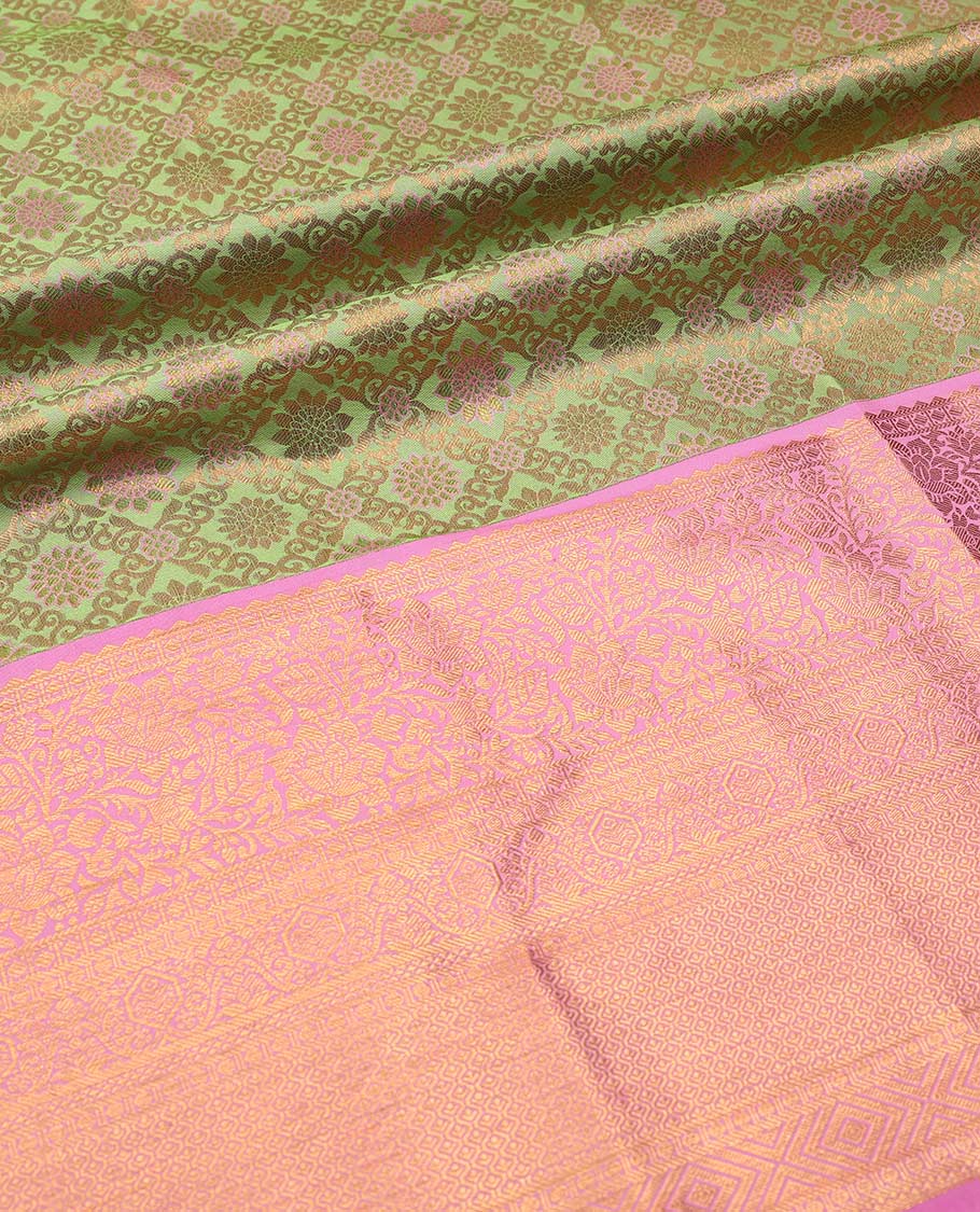 Green pure-silk half saree, jaal jacquard with contrast traditional zari bordered skirt, blouse of rekku, paisa, banaras, rekku, diamond, and then kuli kann, and intricate dhavani