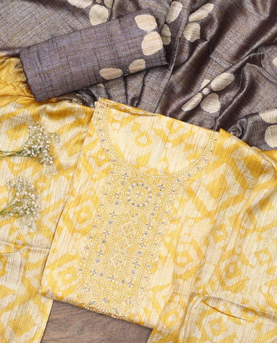 Yellow material chudidar set, batik style printed with neck embroidered top, contrast plain bottom, and batik printed dupatta