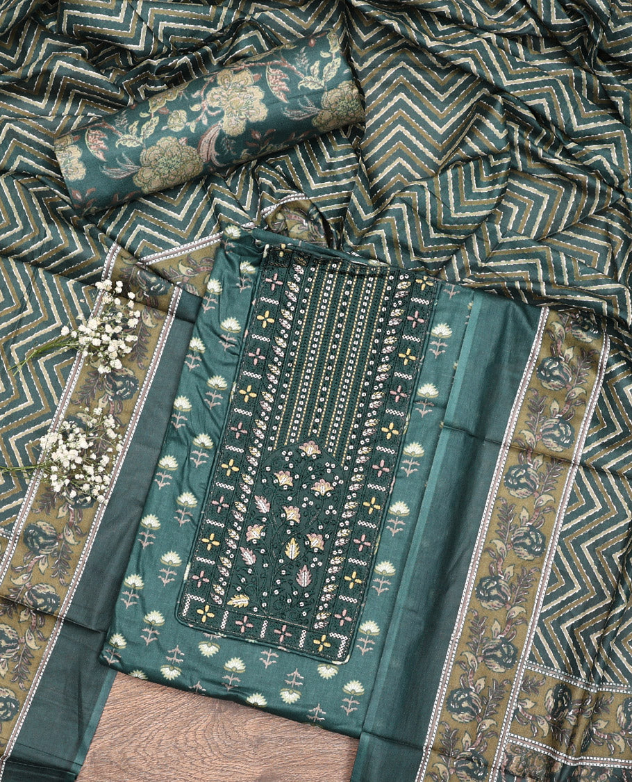 Green Cotton Material Chudidar Set, Adorned with Floral Motifs Block Print, and Neck Embroidery on Its Cotton Top, a Floral Printed Bottom, and Paired with Chevron Printed Cotton Dupatta