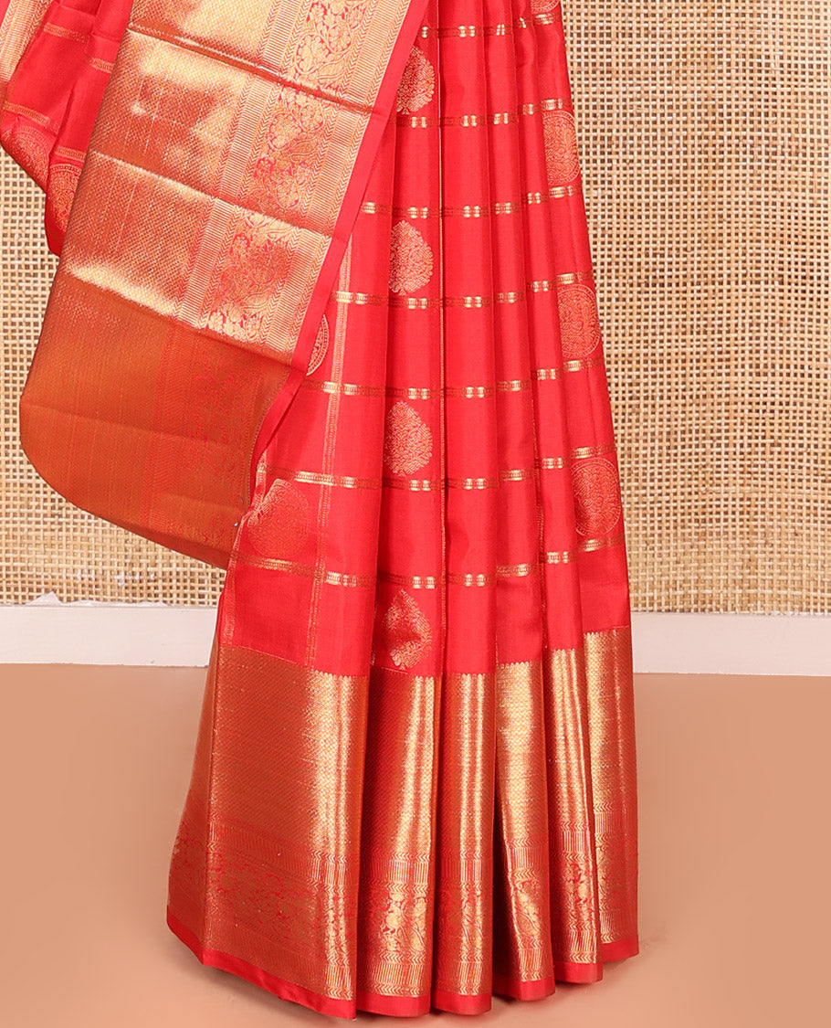Red Vasundhara Silk Saree Artfully Woven with Zari Butta Enclosed Checks All Over Its Body, Highlighted by Zari Border of Rekku, Mayil Kann, Kathir, and Mayil Designs, a Grand Pallu of Jaal Designs, and Paired with a Matching Blouse
