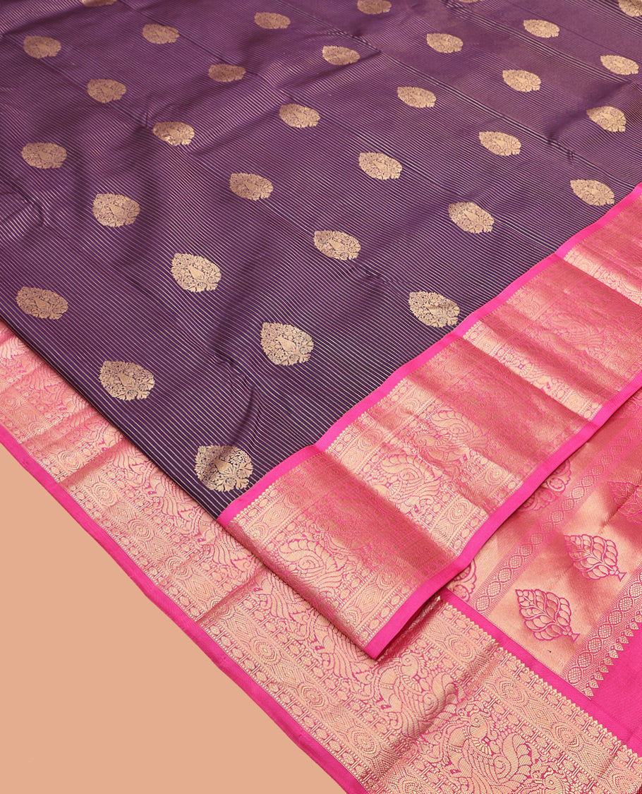 Purple Vasundhara Silk Saree, Detailed with Zari Buttas and Stripes All Over Its Body, Complemented by a Contrast Border of Rekku, Muthu, Poun, Chakram, and Mayil Designs, Grand Manga Design Pallu, and Paired with a Contrast Blouse