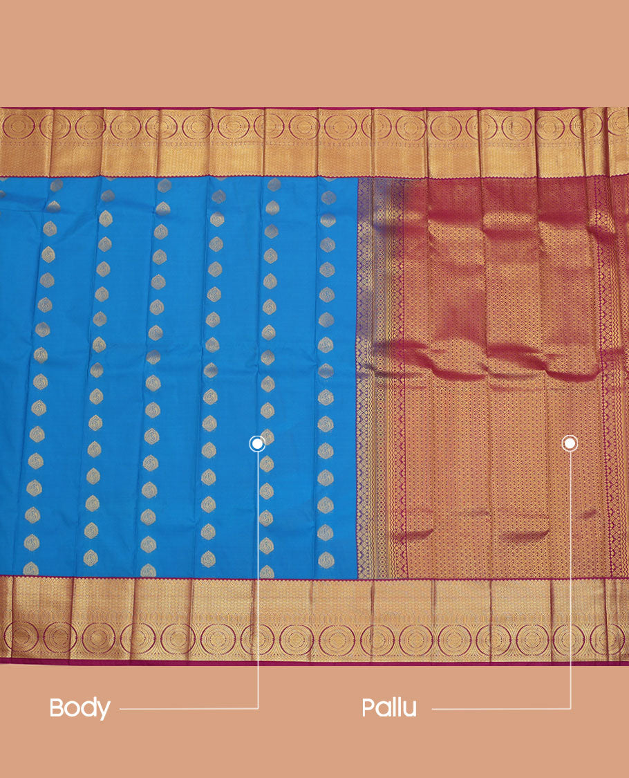 Blue Budget Silk Saree, Adorned with Zari Buttas All Over Its Body, Complemented by a Contrast Traditional Zari Design Border of Chakram Designs, Grand Jaal Pallu, and Paired with a Contrast Blouse