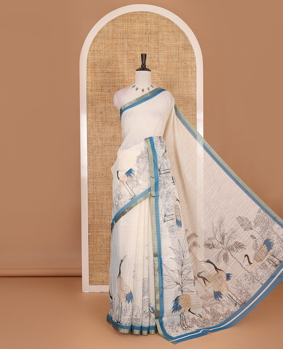 White with blue zari checks linen saree with contrast border and unique designs of pallu along with contrast plain blouse