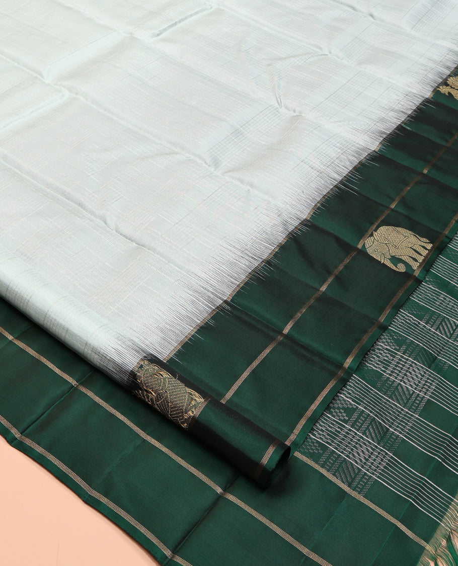 Pale Blue Kanchipuram Silk Saree, Woven with Checks, a Contrast Yaanai-Peacock Buttas Border, Intricate Pallu, and a Contrast Blouse