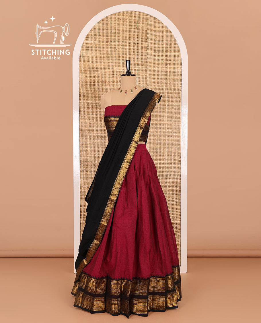 Magenta-black sungudi cotton half-saree, plain with contrast traditional zari varisai pettu bordered skirt, a matching blouse, and a zari bordered dhavani