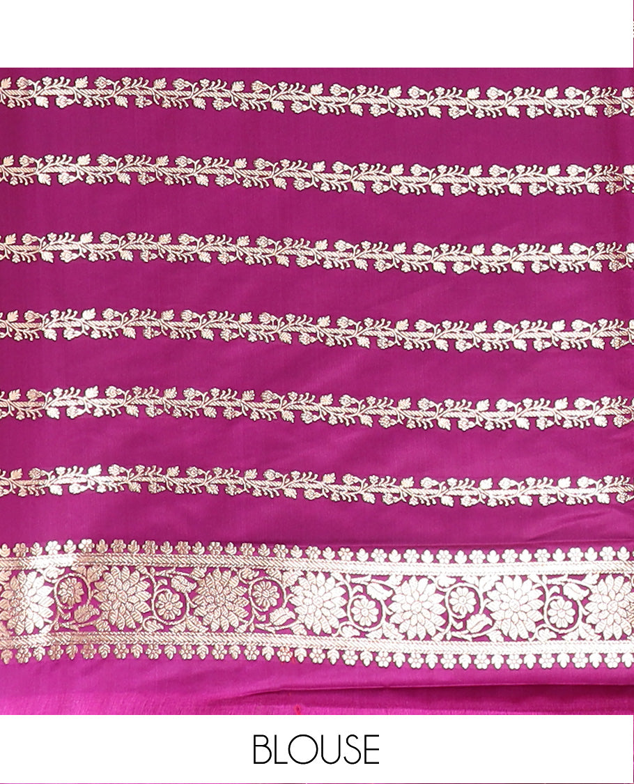 Purple Semi-Banaras Satin Saree Richly Detailed with Zari Buttas, Subtly Sparkled Border of Floral Creeper Designs, Pallu Prettified with Mughal-Style Intricate Motifs in Zari, and Paired with a Matching Blouse