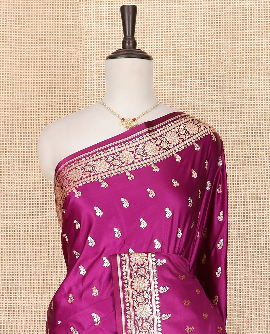 Purple Semi-Banaras Satin Saree Richly Detailed with Zari Buttas, Subtly Sparkled Border of Floral Creeper Designs, Pallu Prettified with Mughal-Style Intricate Motifs in Zari, and Paired with a Matching Blouse
