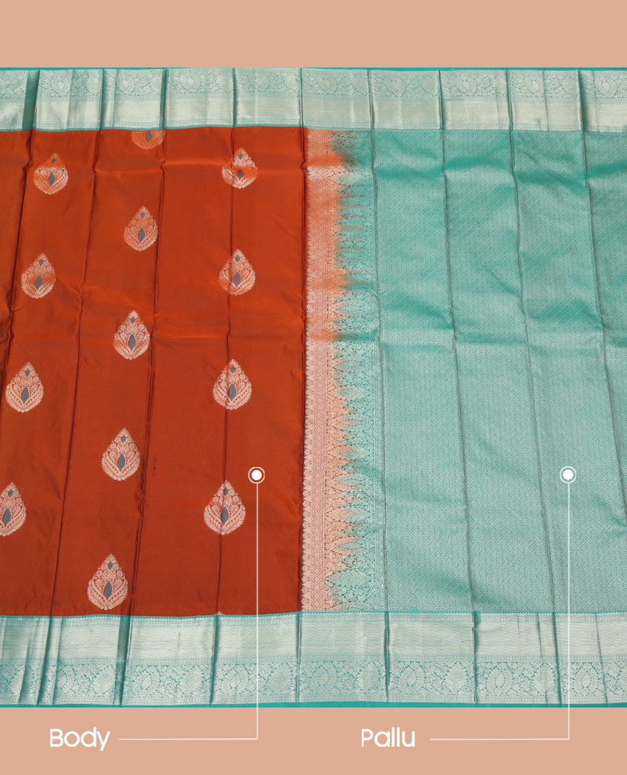 Rust Orange Budget Silk Saree, Masterfully Woven with Meena Buttas All Over Its Body, Complemented by a Contrast Traditional Zari Design Woven Border, Majestically Detailed Pallu of Jaal Designs, and Paired with a Contrast Blouse
