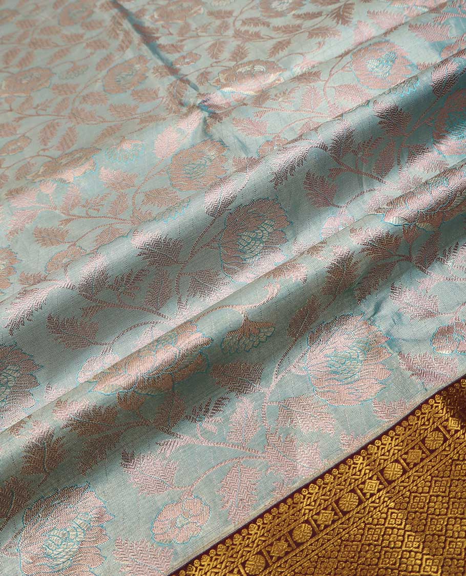 Blue puresilk halfsaree, floral jaal jacquard skirt, contrast blouse, and border of salngai,neli,poun,jaal,manga and jaal, and dhavani of embossed with zari weave