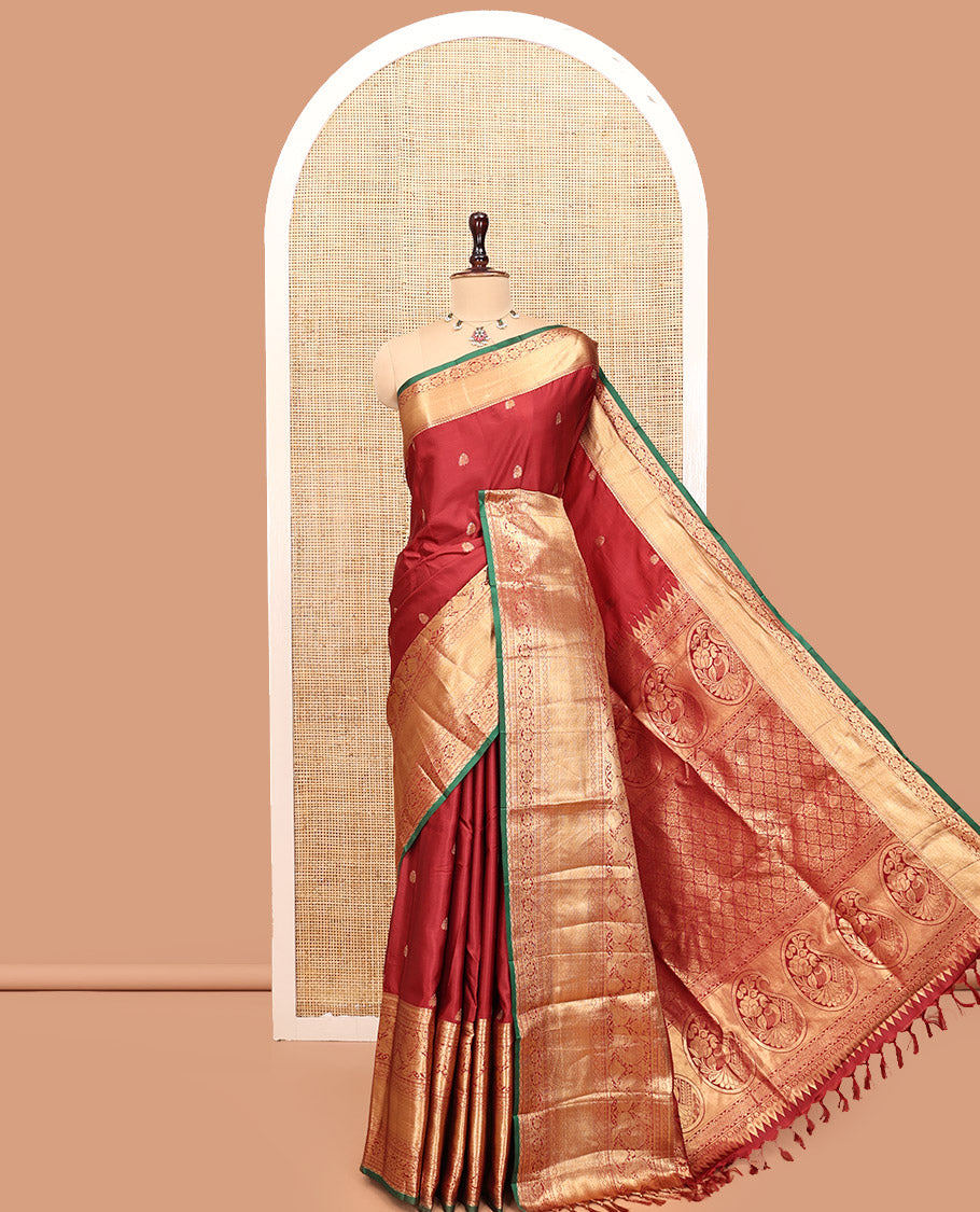 Maroon Budget Silk Saree, Dazzled with Zari Buttas, Highlighted by a Traditional Zari Border, Grand Ogee Pallu, and a Matching Blouse