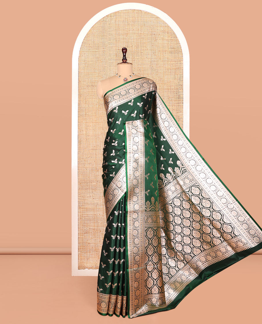 Green Banarasi Nylon Saree, Beautifully Bedecked with Buttas, a Floral Creeper Zari Border, Intricate Pallu, and a Matching Blouse