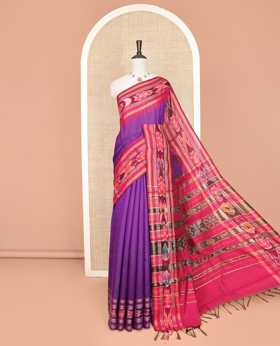 Purple Plain Dupion Silk Saree, Spotlighted with a Contrast Temple Border of Geometric Patterns and Ikkat Weave, Pallu Depicting Floral Ikkat Designs, and Paired with a Contrast Blouse