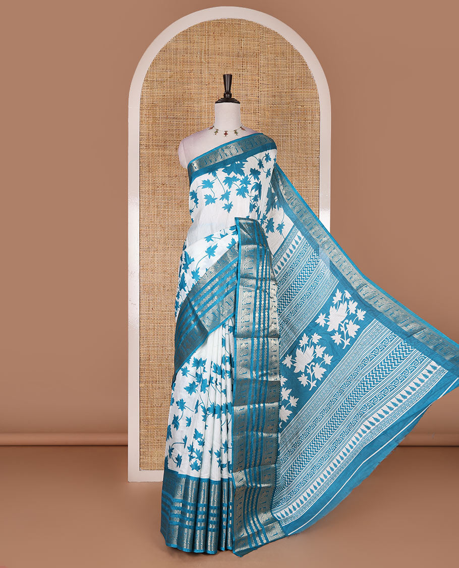Blue leaf motifs printed dola silk saree, contrast traditional zari border of Rudraksham and peacock motifs, geometric printed pallu and contrast printed blouse