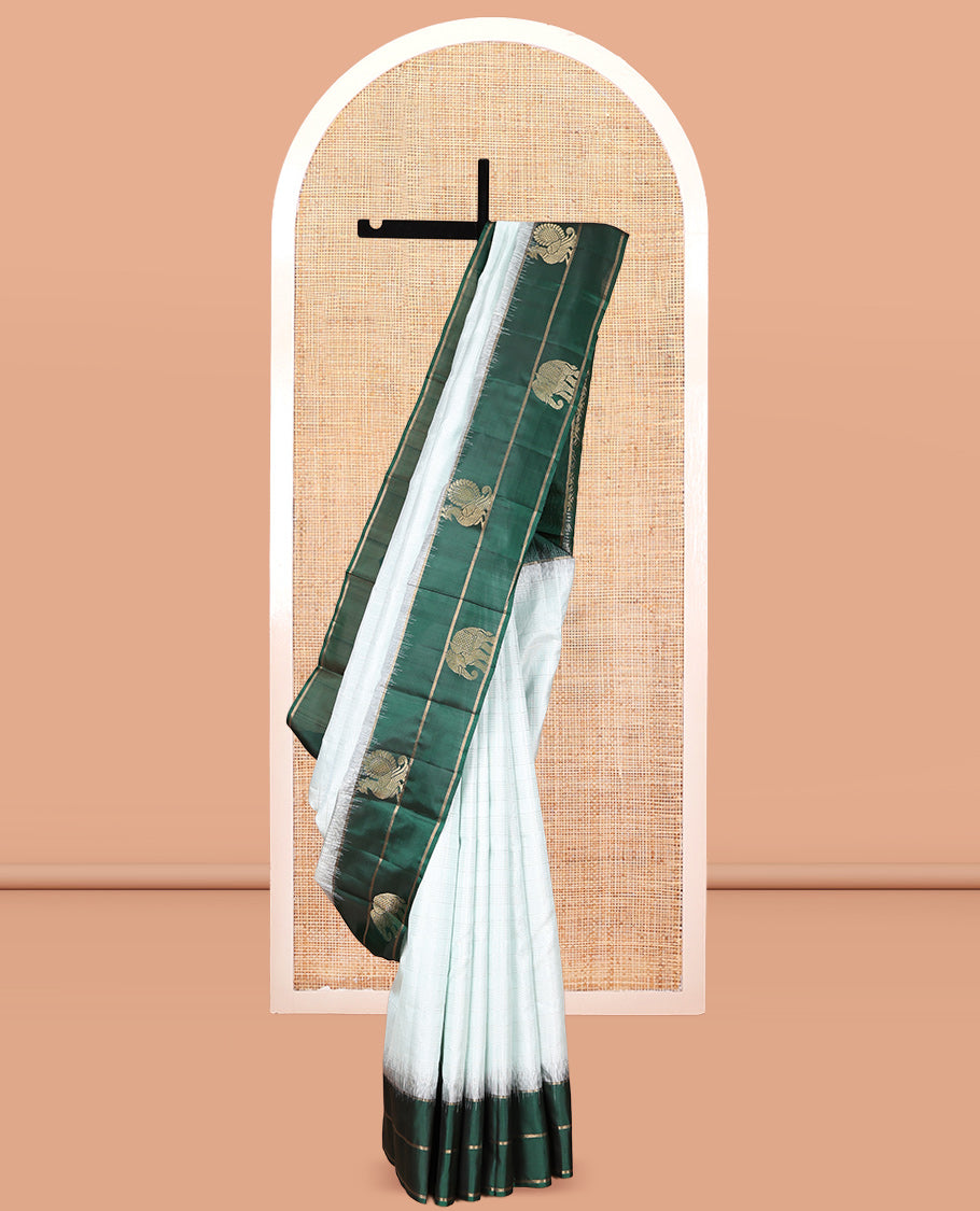 Pale Blue Kanchipuram Silk Saree, Woven with Checks, a Contrast Yaanai-Peacock Buttas Border, Intricate Pallu, and a Contrast Blouse