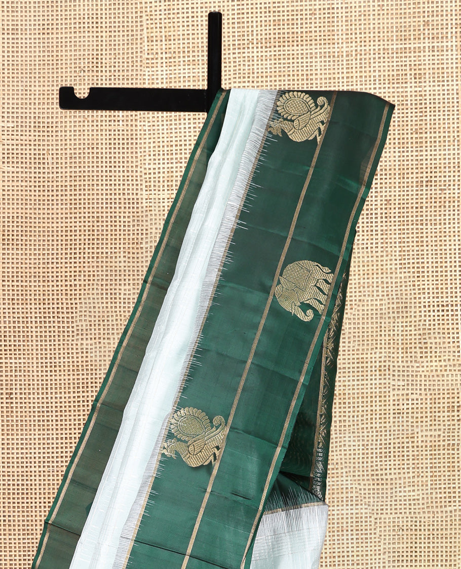 Pale Blue Kanchipuram Silk Saree, Woven with Checks, a Contrast Yaanai-Peacock Buttas Border, Intricate Pallu, and a Contrast Blouse