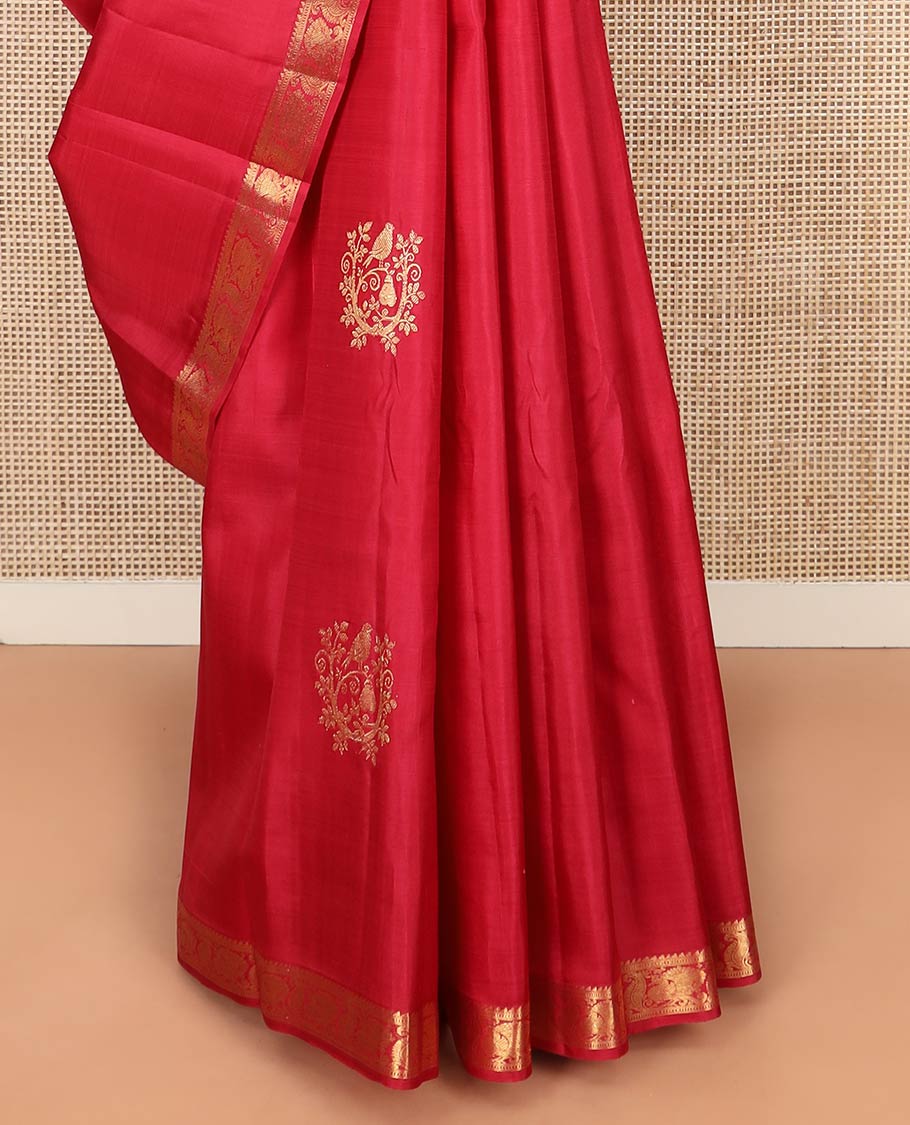 Red Kanchipuram Silk Saree Accentuated with Zari Buttas, Highlighted with Zari Border of Ara Bogudi, Muthu, and Mayil Designs, Grandly Woven Pallu of Jaal Designs, and Paired with a Matching Blouse