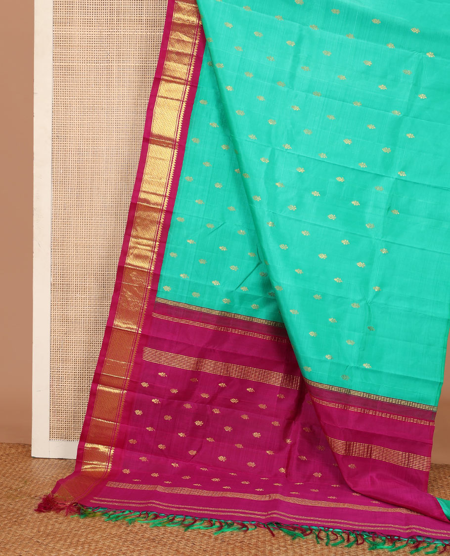 Green zari buttas Kanchipuram silk saree, contrast korvai border of thilakam mokku, and puli nagam, and zari design pallu