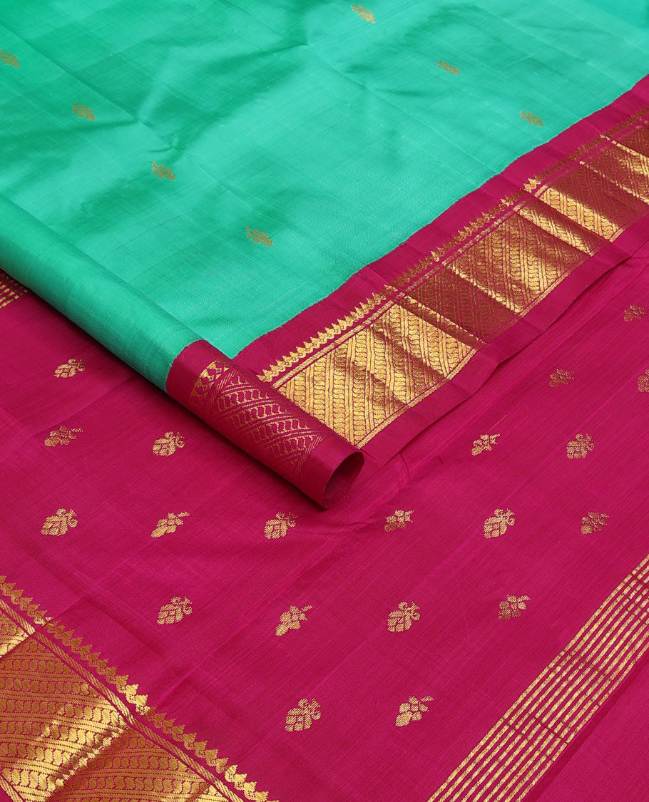 Green zari buttas Kanchipuram silk saree, contrast korvai border of thilakam mokku, and puli nagam, and zari design pallu