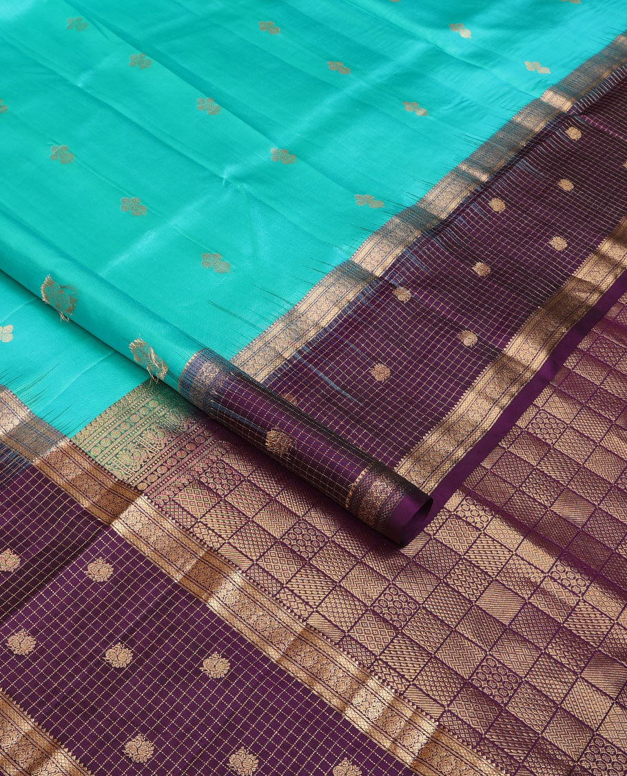 Blue zari buttas soft silk saree, contrast border of thilakam,jada nagam,mayil kann, zari checked & mayil designs & geometric patterned pallu