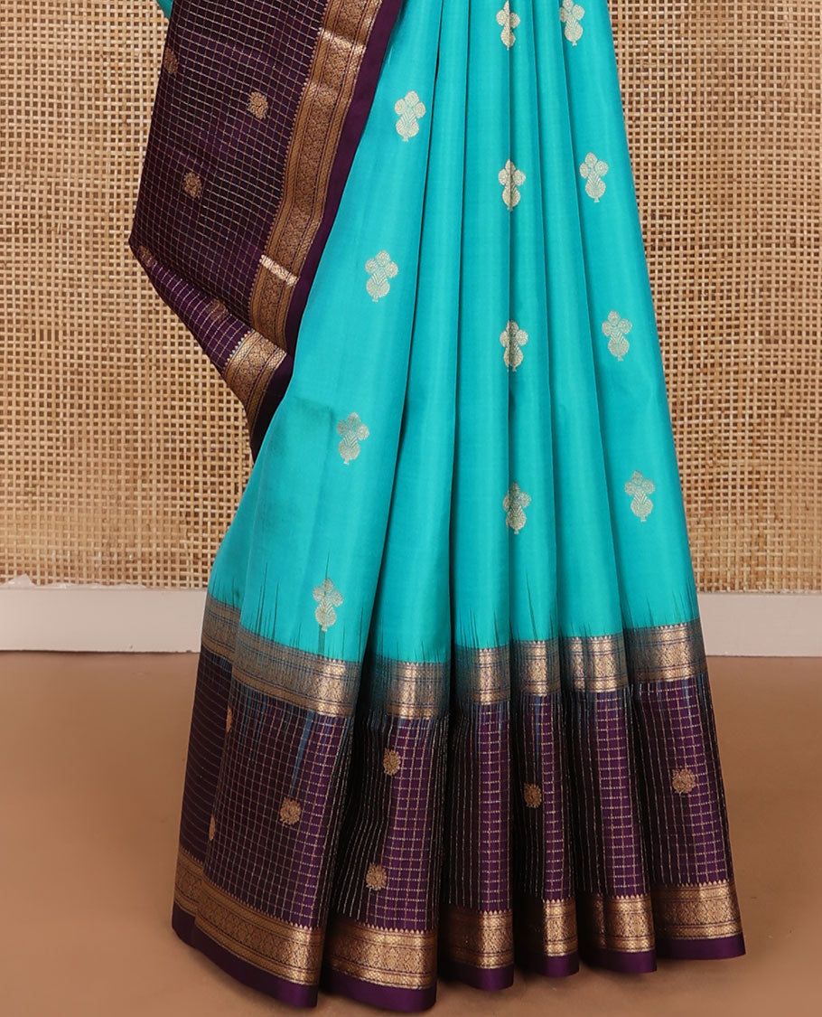 Blue zari buttas soft silk saree, contrast border of thilakam,jada nagam,mayil kann, zari checked & mayil designs & geometric patterned pallu