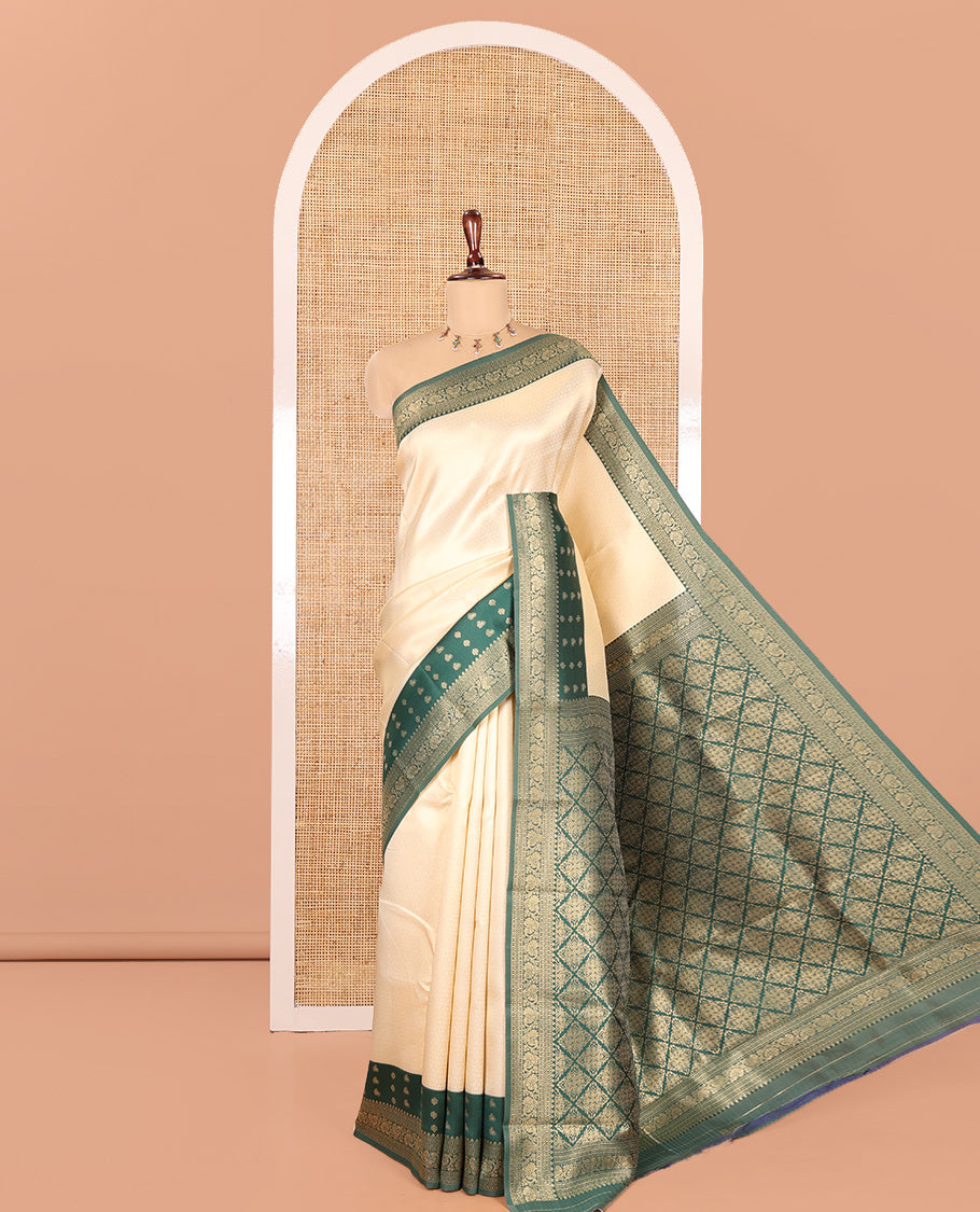 Cream-Green Embossed Art Kanchi Silk Saree, a Contrast Traditional Zari Border, Grand Jaal Pallu, and a Contrast Blouse