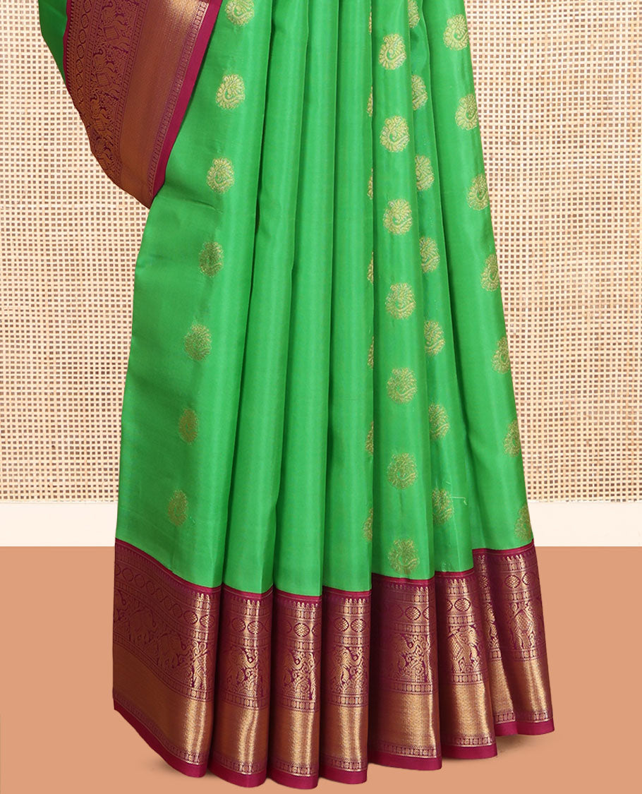 Green Vasundhara Lite Silk Mix Saree, Embellished with Zari Buttas, a Contrast Border of Banaras, Poun, Kamalam, Yaanai, and Mayil Kann Designs, Grand Pallu, and a Contrast Blouse