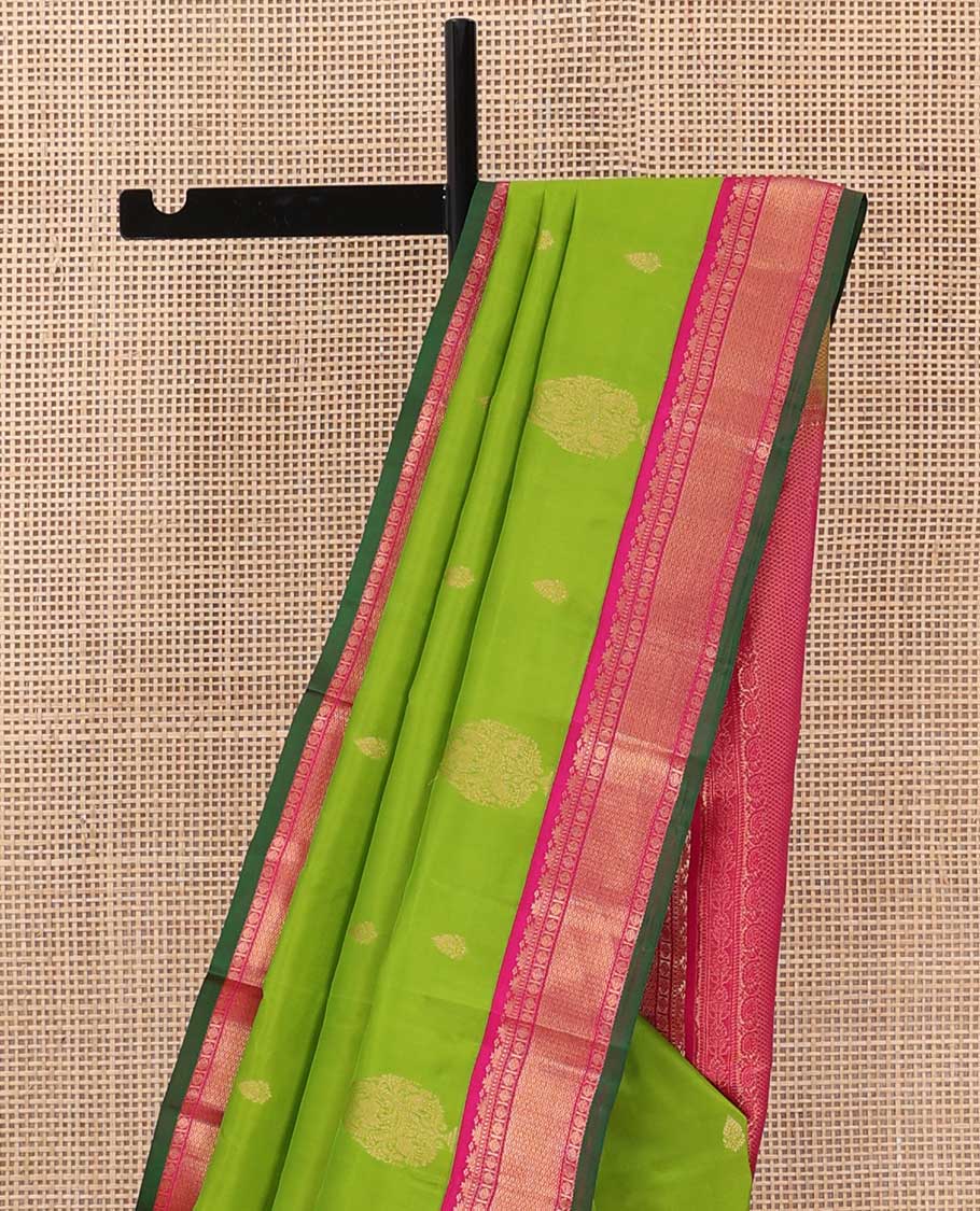Parrot green zari buttas silk saree, contrast border of rekku, Muthu, poun, and mayil kann, and pallu of mayil kann and manga designs