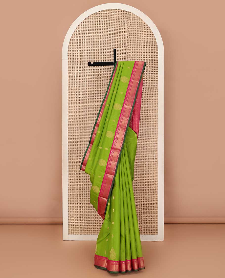 Parrot green zari buttas silk saree, contrast border of rekku, Muthu, poun, and mayil kann, and pallu of mayil kann and manga designs