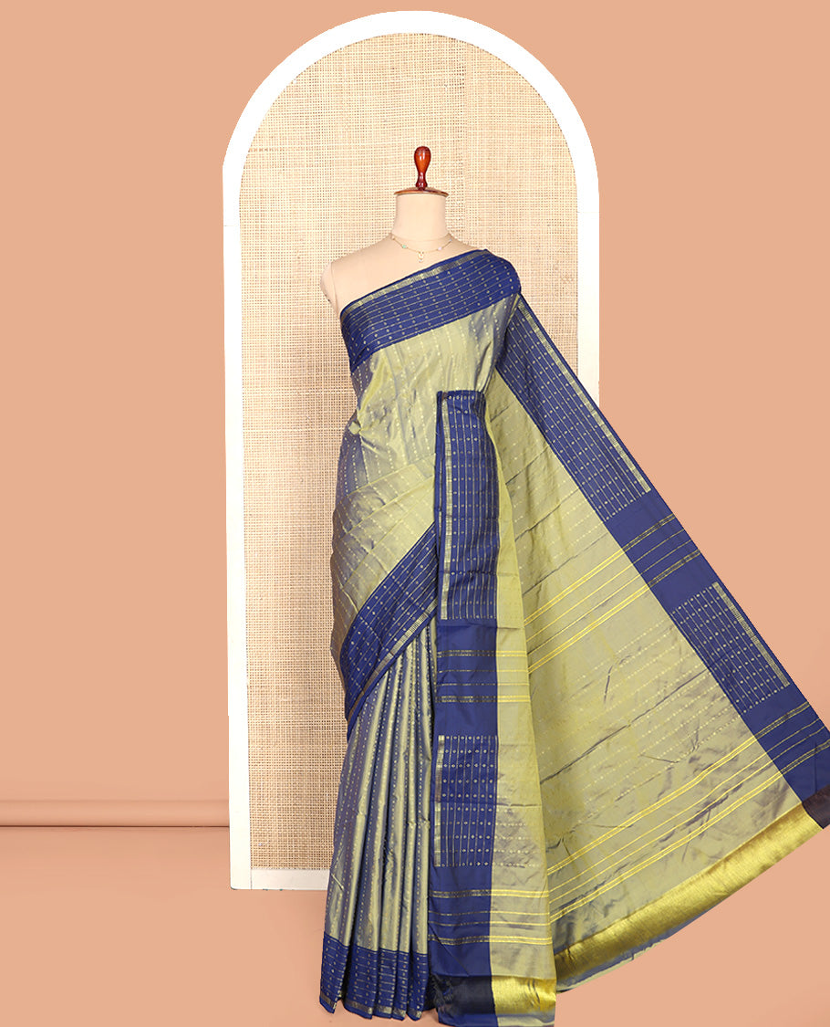 Green Aarani Silk Saree, Ornamented with Zari Stripes All Over Its Body, Complemented by a Contrast Zari Stripes and Buttas Woven Border, Pallu of Stripes, and Paired with a Matching Blouse