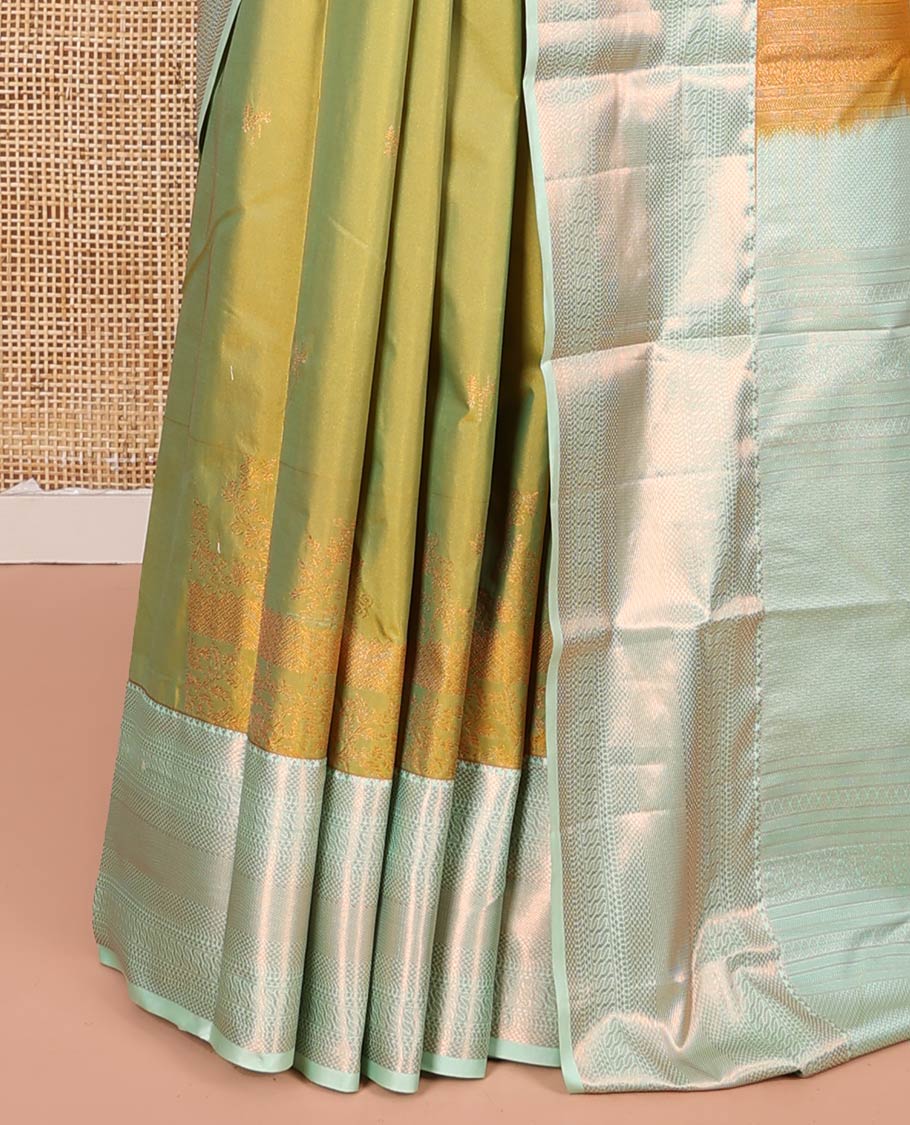 Green Budget Silk Saree, Decked Up with Zari Buttas All Over Its Body, Complemented by a Contrast Traditional Zari Design Border, Intricately Zari Designed Pallu, and Paired with a Contrast Blouse