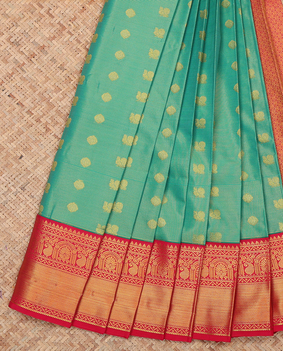 Green Budget Silk Saree, Gleamed Up with Peacock-Chakram Buttas, a Contrast Traditional Zari Border, Grand Pallu, and a Contrast Blouse