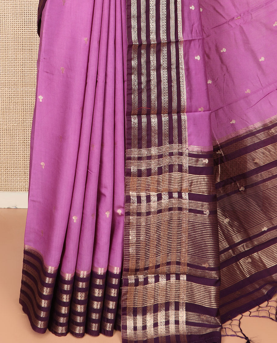 Light Purple Assam Silk Saree Beautified with Zari Buttas, Complemented by Contrast Zari Border Featuring Traditional Zari Designs, a Gleaming Pallu of Zari Stripes, and Paired with a Contrast Blouse