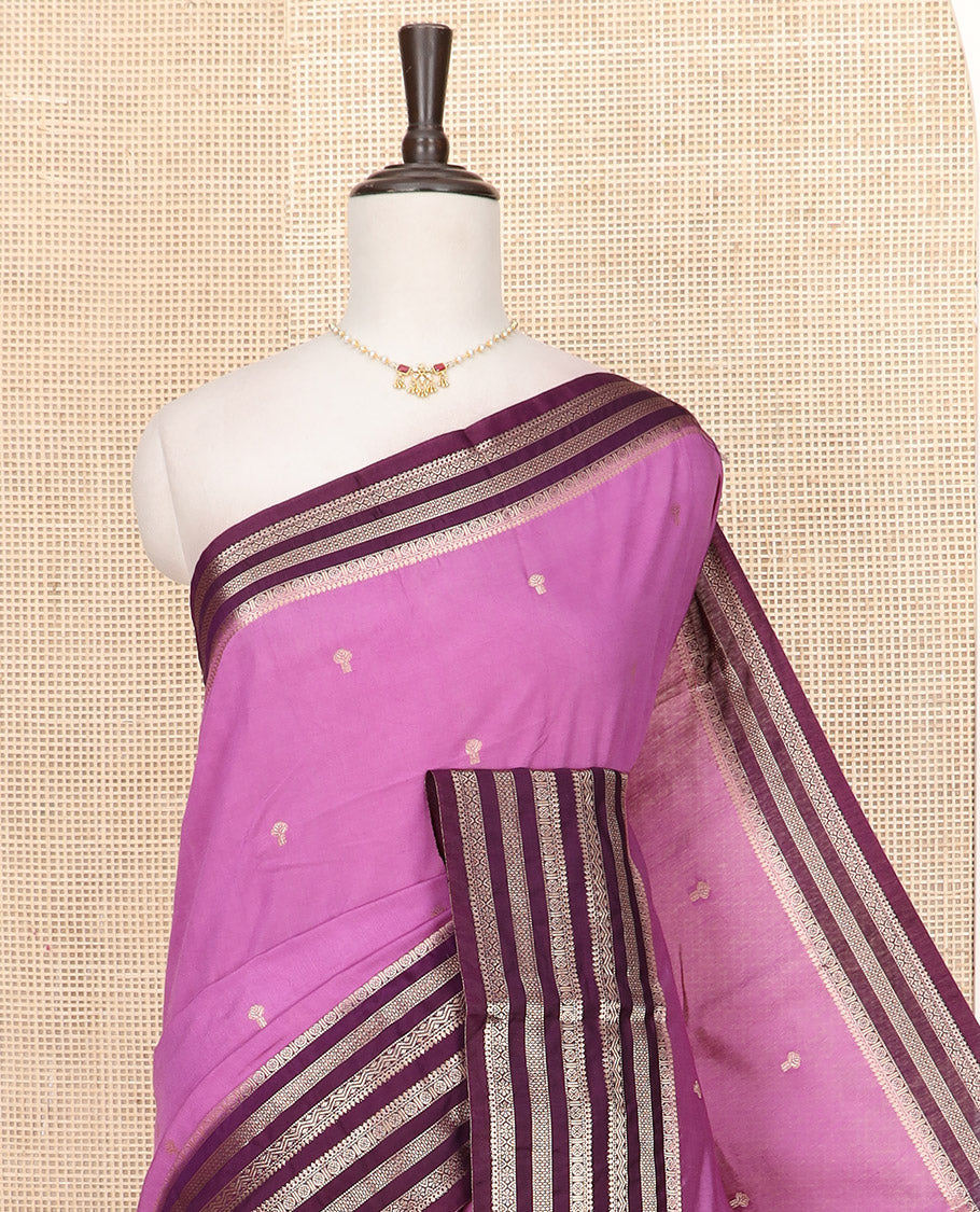 Light Purple Assam Silk Saree Beautified with Zari Buttas, Complemented by Contrast Zari Border Featuring Traditional Zari Designs, a Gleaming Pallu of Zari Stripes, and Paired with a Contrast Blouse