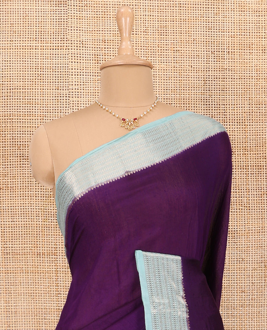 Eggplant Purple Plain Assam Silk Saree, Complemented by Contrast Traditional Zari Design Border, Pallu Trimmed with Zari Stripes, and Paired with a Contrast Blouse