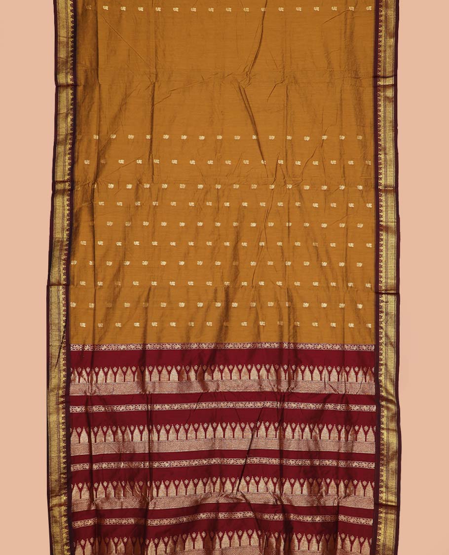 Mustard buttas nine-yard cotton saree, contrast traditional zari border, and pallu steeped with traditional motifs
