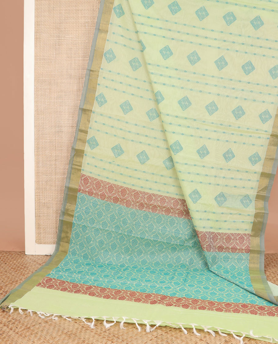Green buttas kanchi cotton saree, contrast bavanji border, and pallu of ogee designs