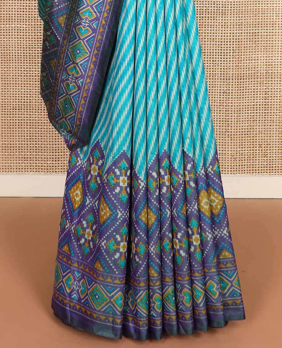 Blue diagonal striped semi-banaras patola silk saree, contrast diamond and elephant motif border, and pallu of diamond design