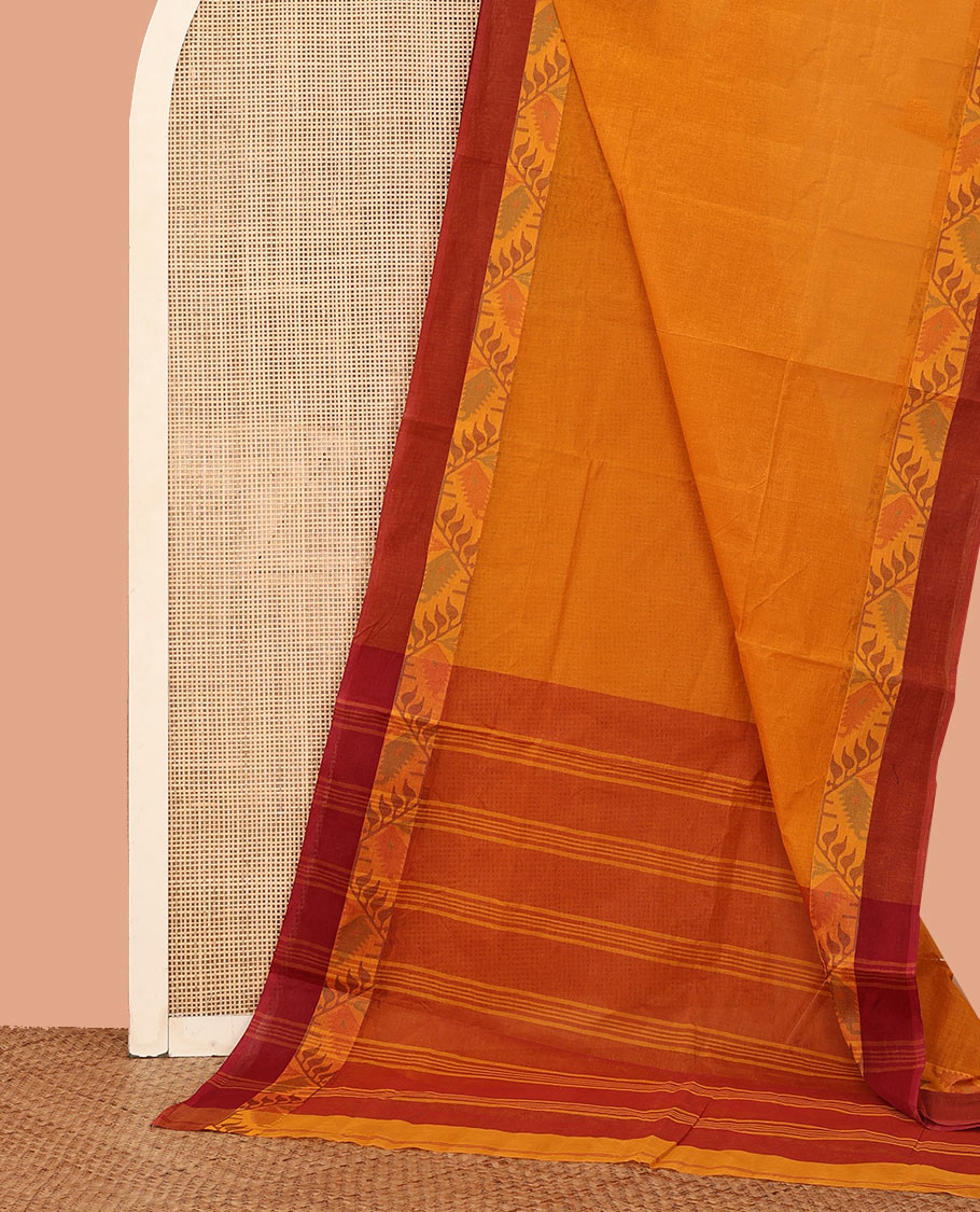 Orange Plain Bengal Cotton Saree, Complemented by Contrast Border Features Floral Creeper Designs, Striped Pallu, and Comes Without a Blouse