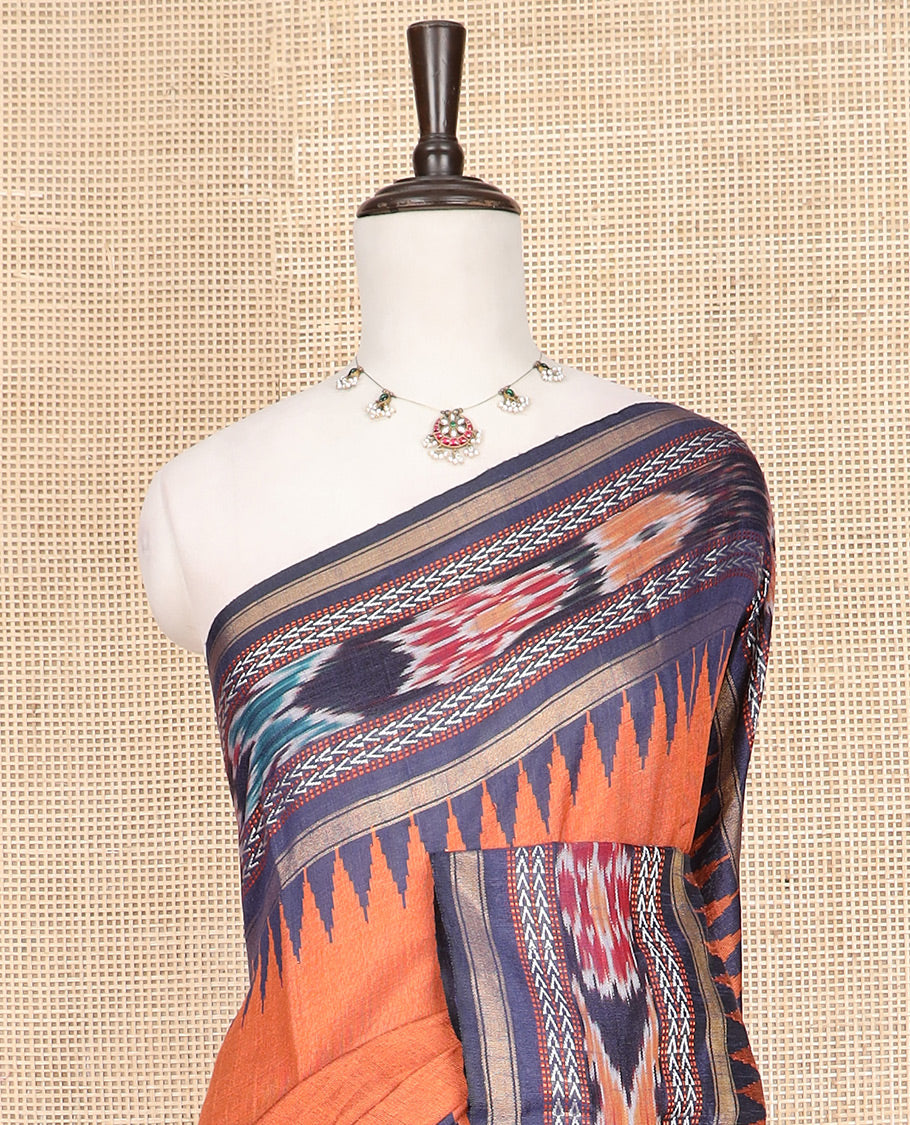 Orange Plain Dupion Silk Saree, Adorned with a Contrast Temple Border of Geometric Patterns and Ikkat Weave, Pallu Depicting Floral Ikkat Designs, and Paired with a Contrast Blouse