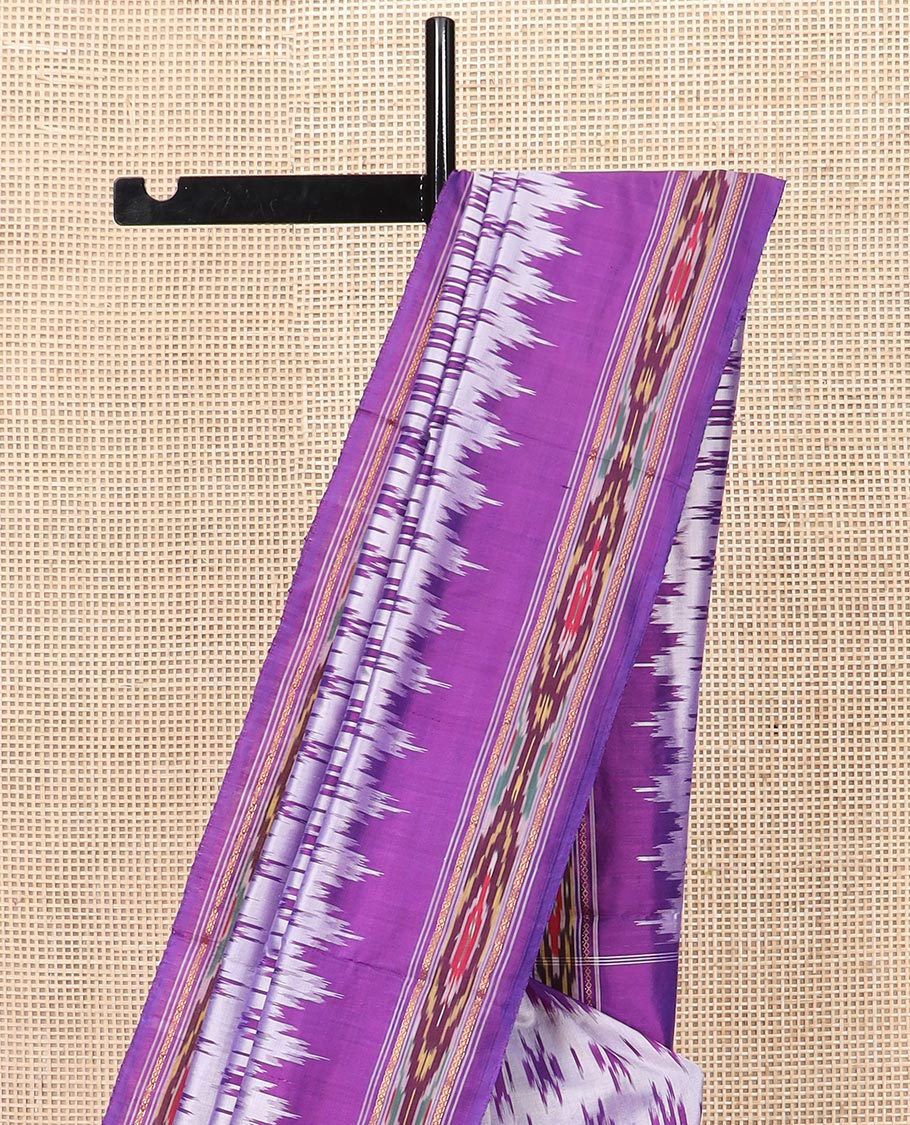 Grey Ikkat Silk Saree with Buttas Across the Body, spotlighted with a Contrast temple Ikkat-Textured Border, and Pallu Features Stripes and Ikkat Texture