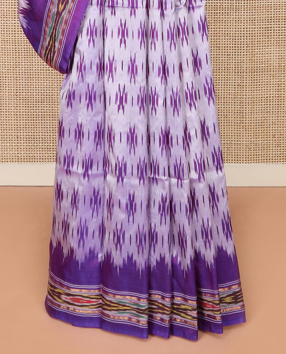 Grey Ikkat Silk Saree with Buttas Across the Body, spotlighted with a Contrast temple Ikkat-Textured Border, and Pallu Features Stripes and Ikkat Texture