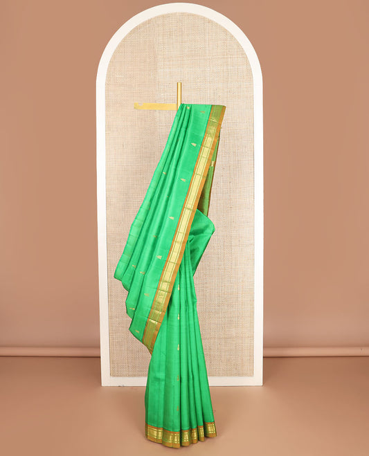 Green zari buttas kanchipuram silksaree, contrast one-sided border of thazampoo rekku,banaras & jaal design & zari design pallu